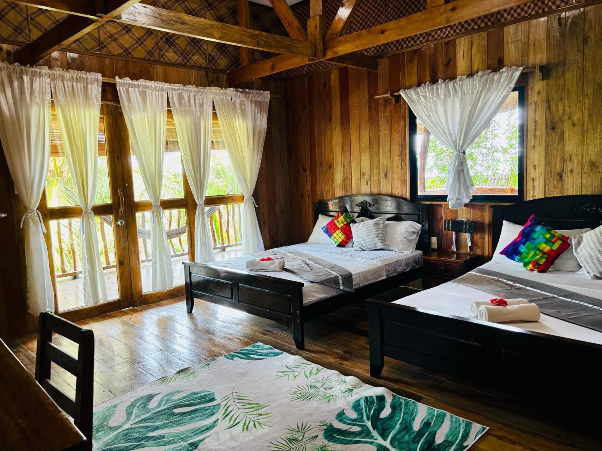 ไวต์ บีช ฟรอนต์ แอนด์ คอตเทจส์ ฮีนุกตัน รีสอร์ต อิน บูรูอังกา Villa Buruanga ภายนอก รูปภาพ